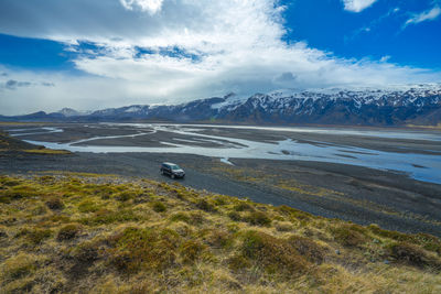 Scenic view of landscape against sky during winter