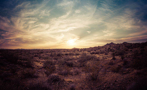 Scenic view of landscape against sky during sunset