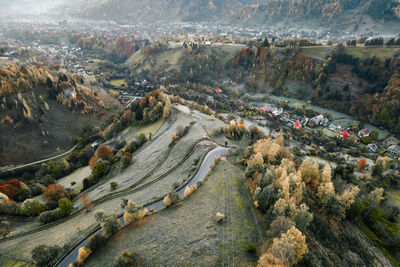 Drone view of hills and village in autumn