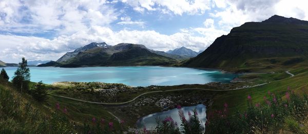 Scenic view of lake and mountains against sky