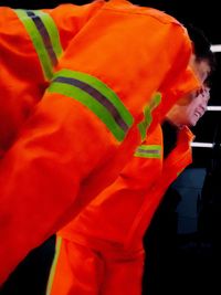 Close-up of man with orange hair standing at home