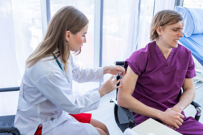Doctor examining patient at clinic