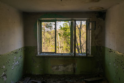 Abandoned house and a ruined house with a beautiful view outside the window