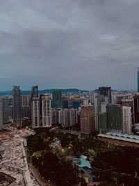 High angle view of buildings in city against sky