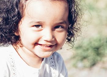 Close-up portrait of smiling girl