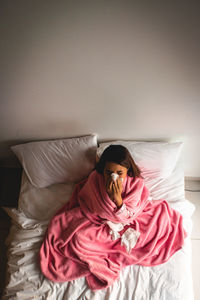 Woman relaxing on bed