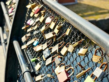 Close-up of padlocks on railing