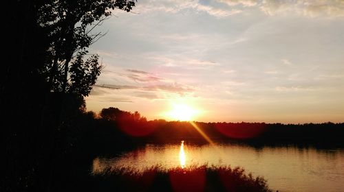 Scenic view of sunset over river