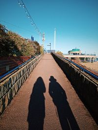 People walking on railroad track