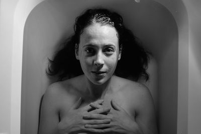 High angle portrait of woman lying in bathtub