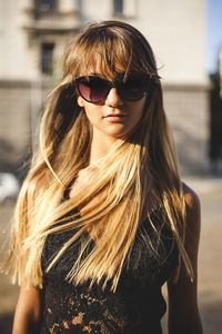 Portrait of young woman wearing sunglasses