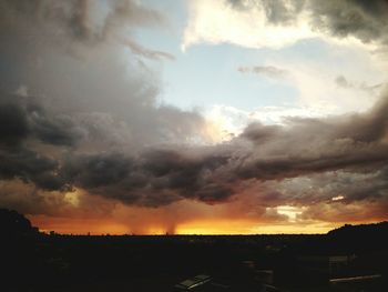 Scenic view of landscape against cloudy sky