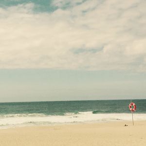 Scenic view of beach against sky