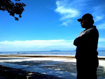 Man looking at sea against sky