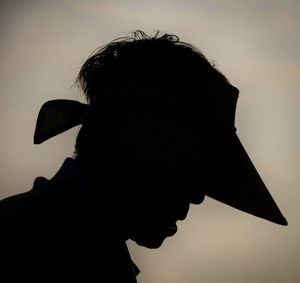 Low angle view of people against sky