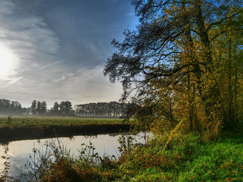 Scenic view of lake against sky during autumn