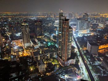 High angle view of illuminated city buildings at night