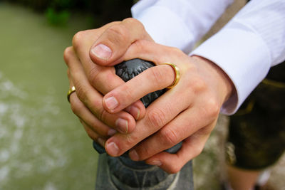 Close-up of man holding hands