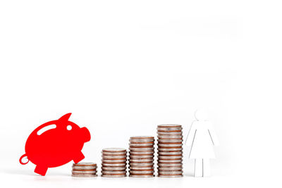 Stack of red bell against white background