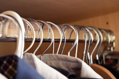 Close-up of shirts hanging on clothes rack