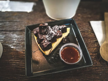 Close-up of dessert in plate on wooden table