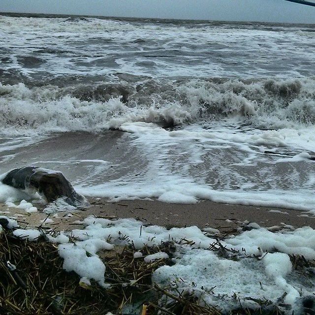 water, sea, surf, wave, shore, beauty in nature, beach, nature, scenics, tranquility, tranquil scene, motion, rock - object, outdoors, day, no people, idyllic, winter, remote, cold temperature