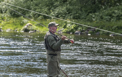 Man fishing in lake