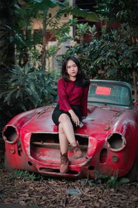 Portrait of young woman in car
