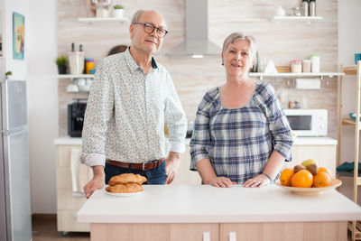 Man and woman holding ice cream