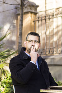 Man smoking cigarette outdoors