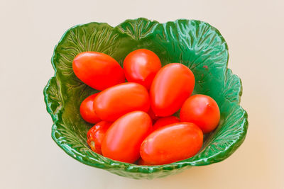 High angle view of tomatoes against white background