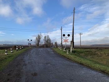Road sign against sky