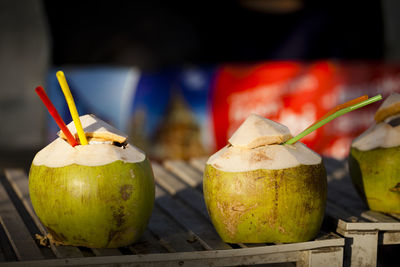 Coconut waters with straws on table