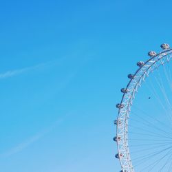 Low angle view of ferris wheel against sky