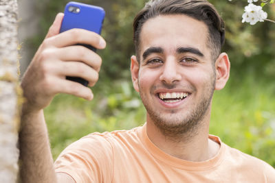 Portrait of young man photographing