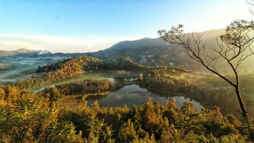 Scenic view of lake and mountains against sky