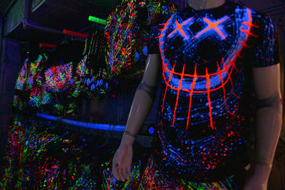 Rear view of woman standing in forest