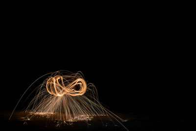 Light trails against sky at night