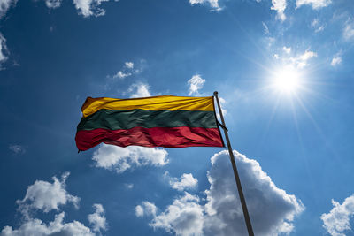 Vilnius, lithuania. may 2019. the lithuanian flag waving in the sky