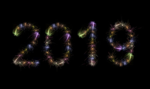 Close-up of firework display over black background