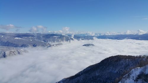 Scenic view of snowcapped mountains against sky