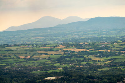 Aerial view of agricultural field against sky