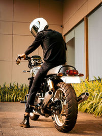 Man riding motorcycle on street