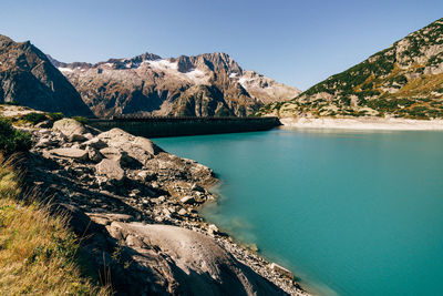 Scenic view of bay against clear sky