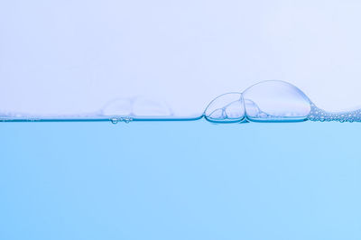 Close-up of bubbles against white background