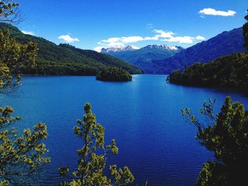 Scenic view of lake against blue sky