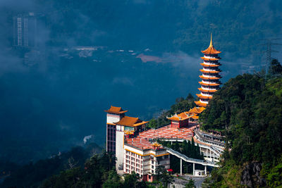 Low angle view of pagoda against sky in city