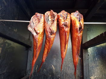 High angle view of fishes on barbecue grill