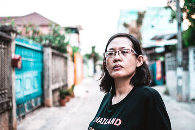 Portrait of woman standing outdoors