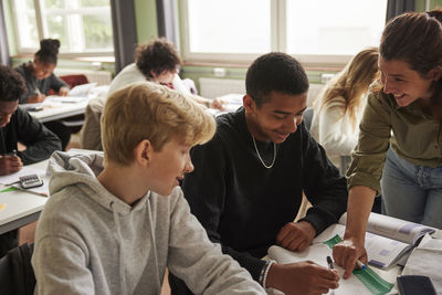 Side view of people sitting at restaurant